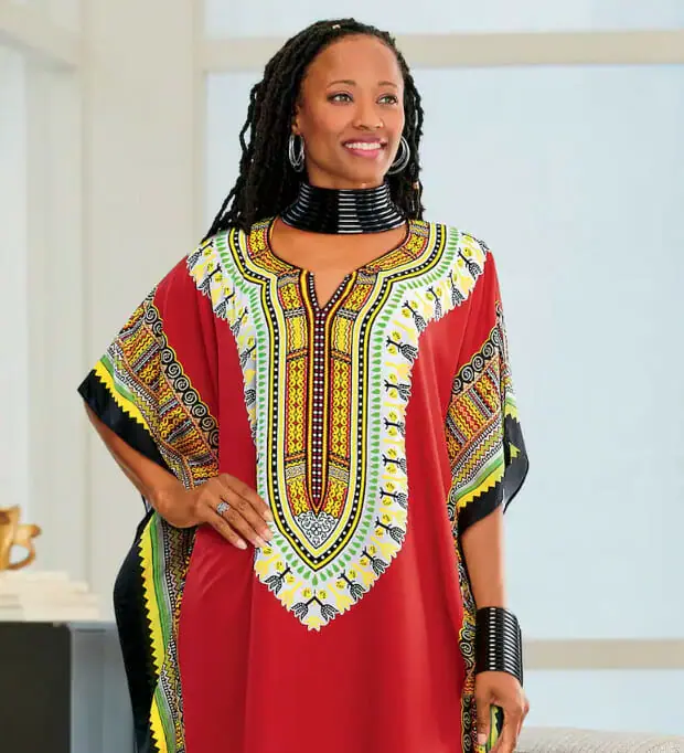Black woman wearing a dashiki print caftan