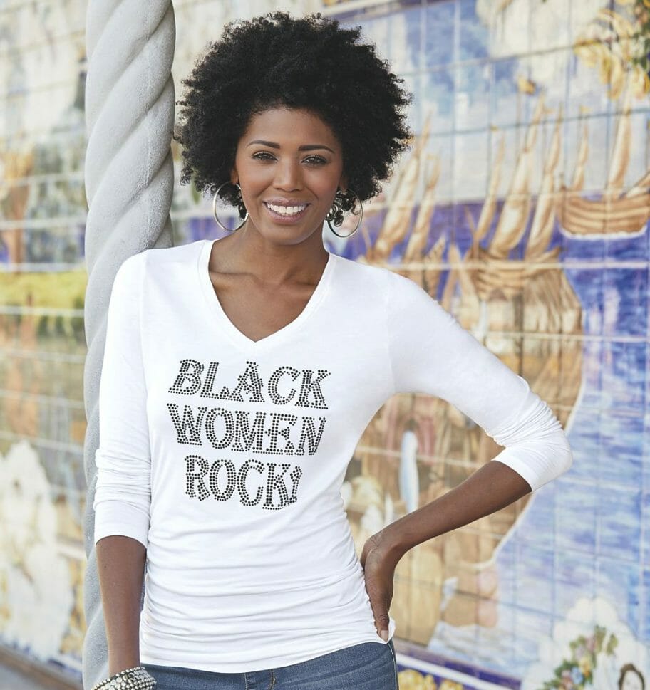 Black woman wearing white shirt with 'Black Women Rock!' bling wording