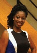 Ashro lookbook customer Barbara, a smiling black woman in a navy, white and black dress, with hair to the side.