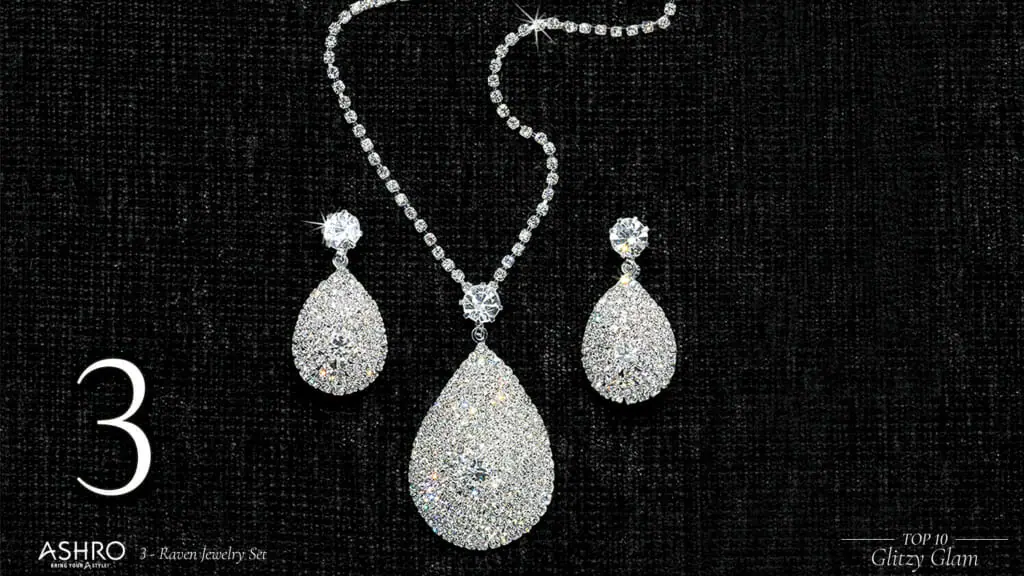 A diamond-like necklace with a tear-drop pendant and matching tear-drop earrings.