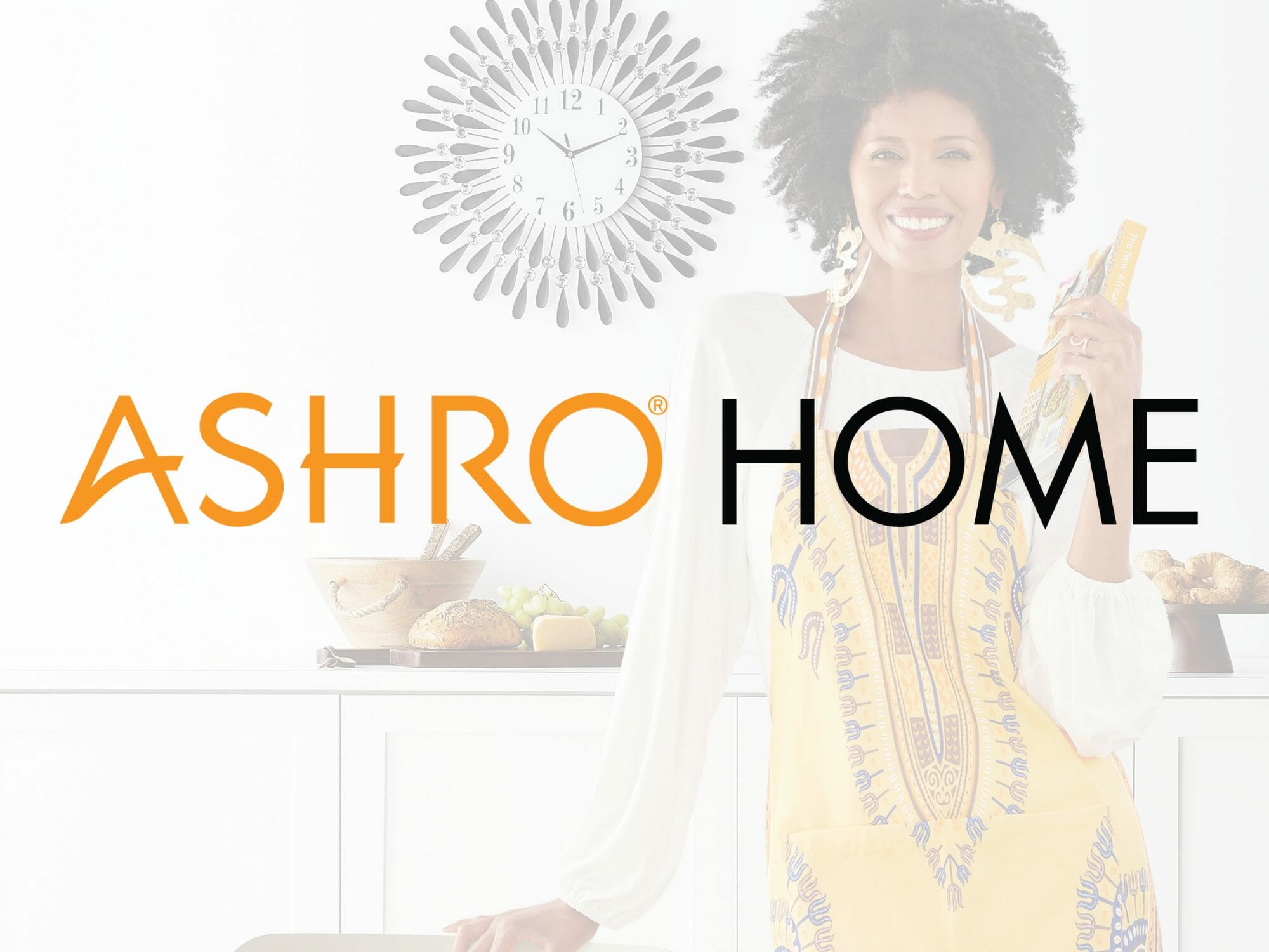 Black woman wearing apron holding cookbook