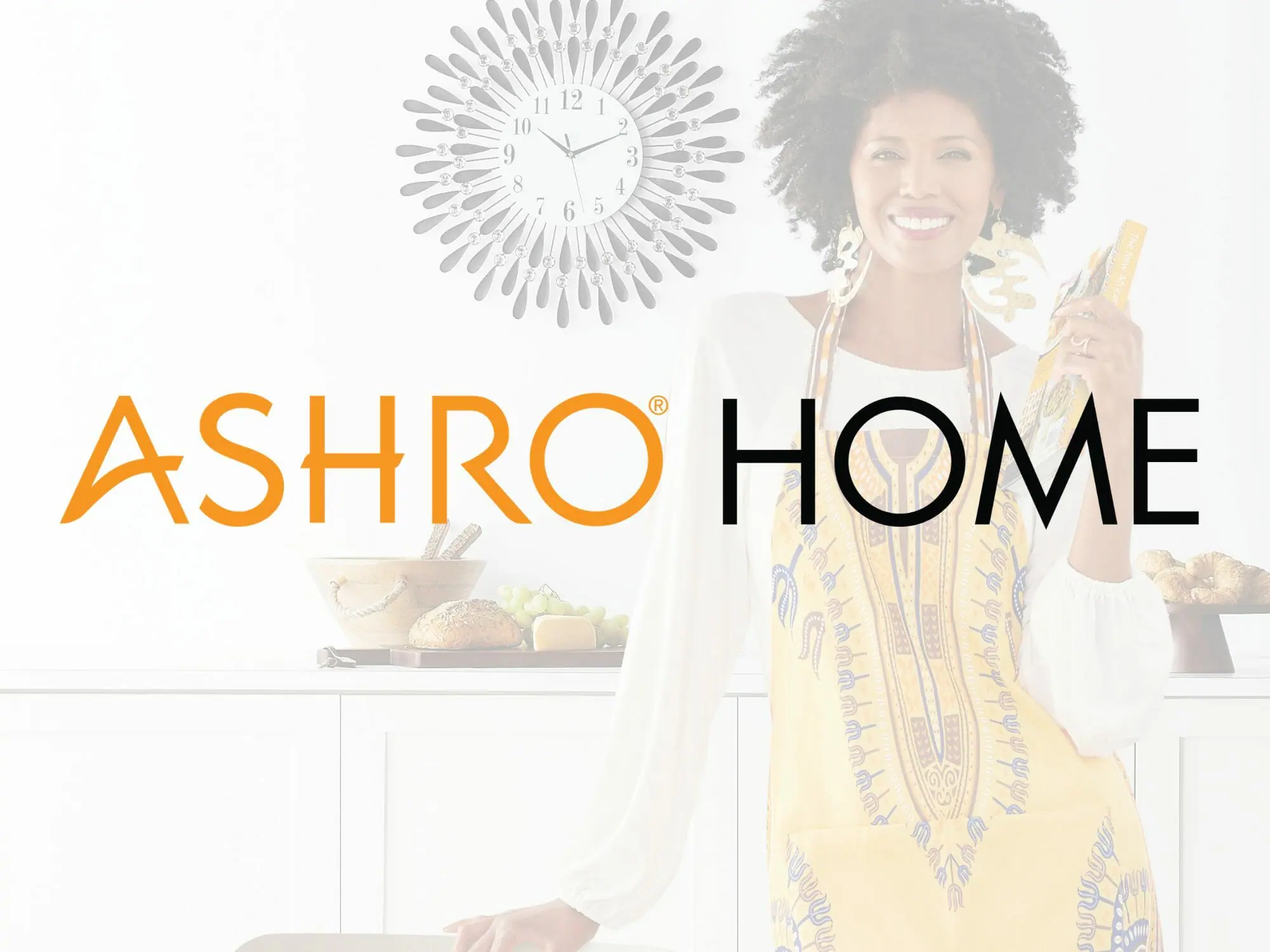 Black woman wearing apron holding cookbook