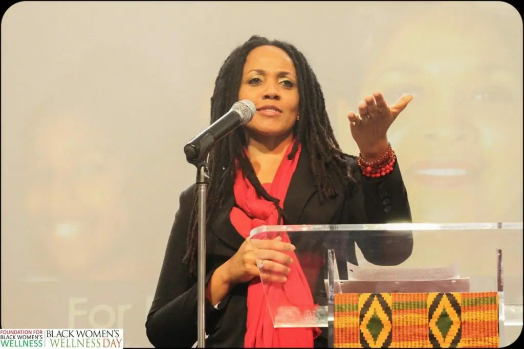 Black woman speaking at podium