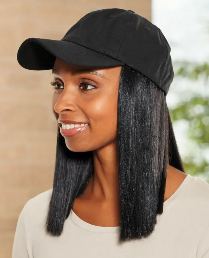 Ashro model wearing Vivica Fox Trina Wig and Cap