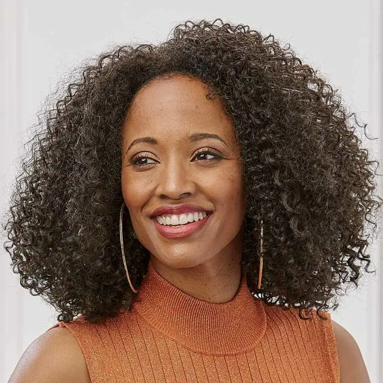 African American woman wearing the Vivica Fox Leya Wig in Dark Brown