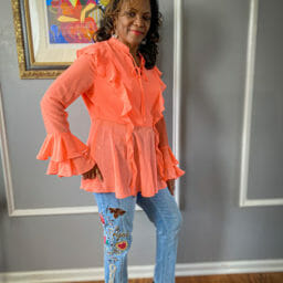 Ashro customer wearing flowy top & jeans
