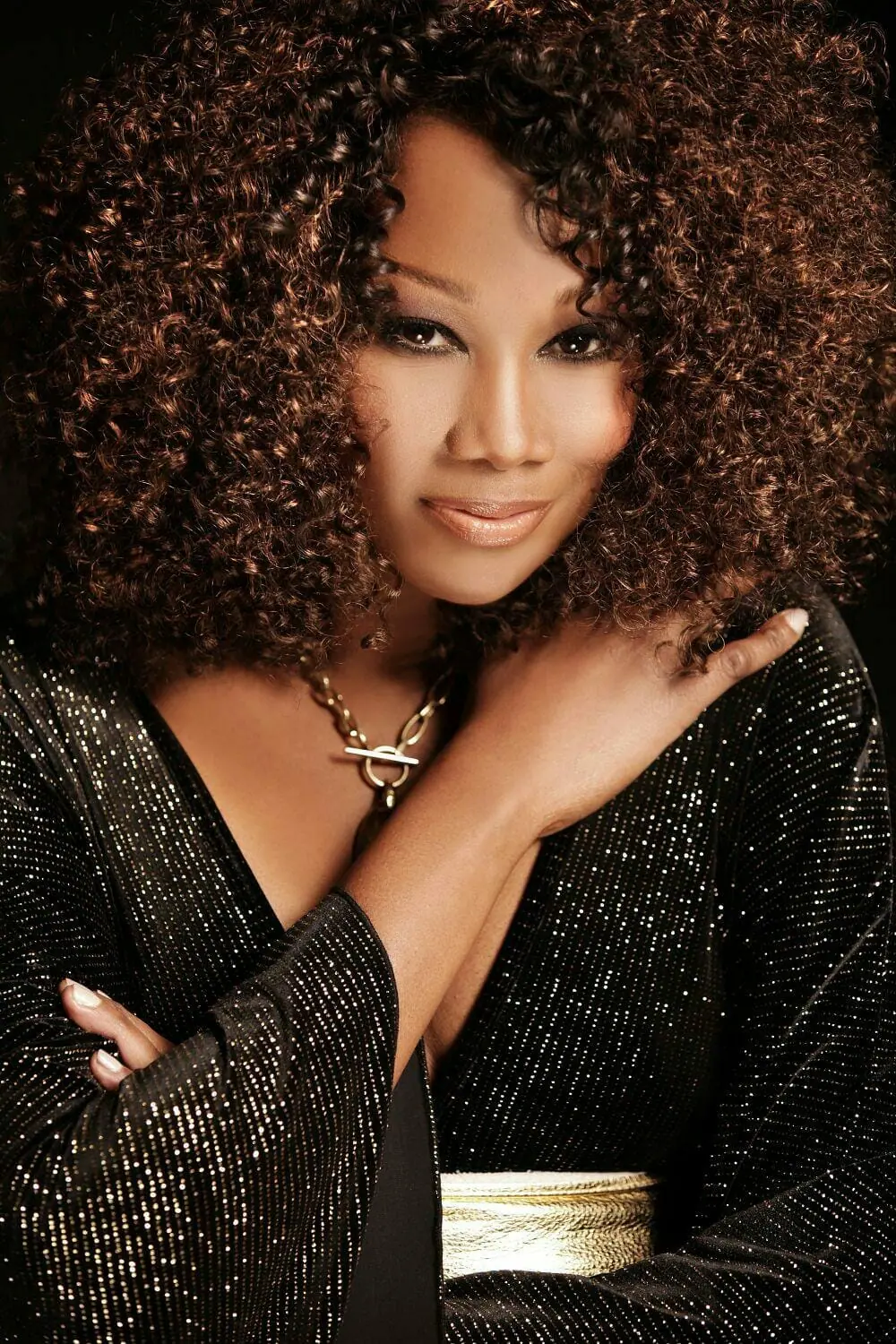 Yolonda Adam Posing in a sparking black gown