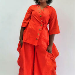 Ashro customer posing in orange Tunic