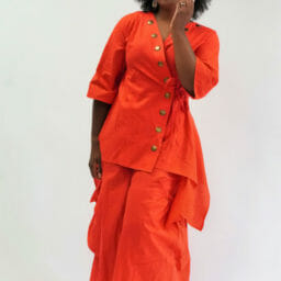 Ashro customer posing in orange Tunic