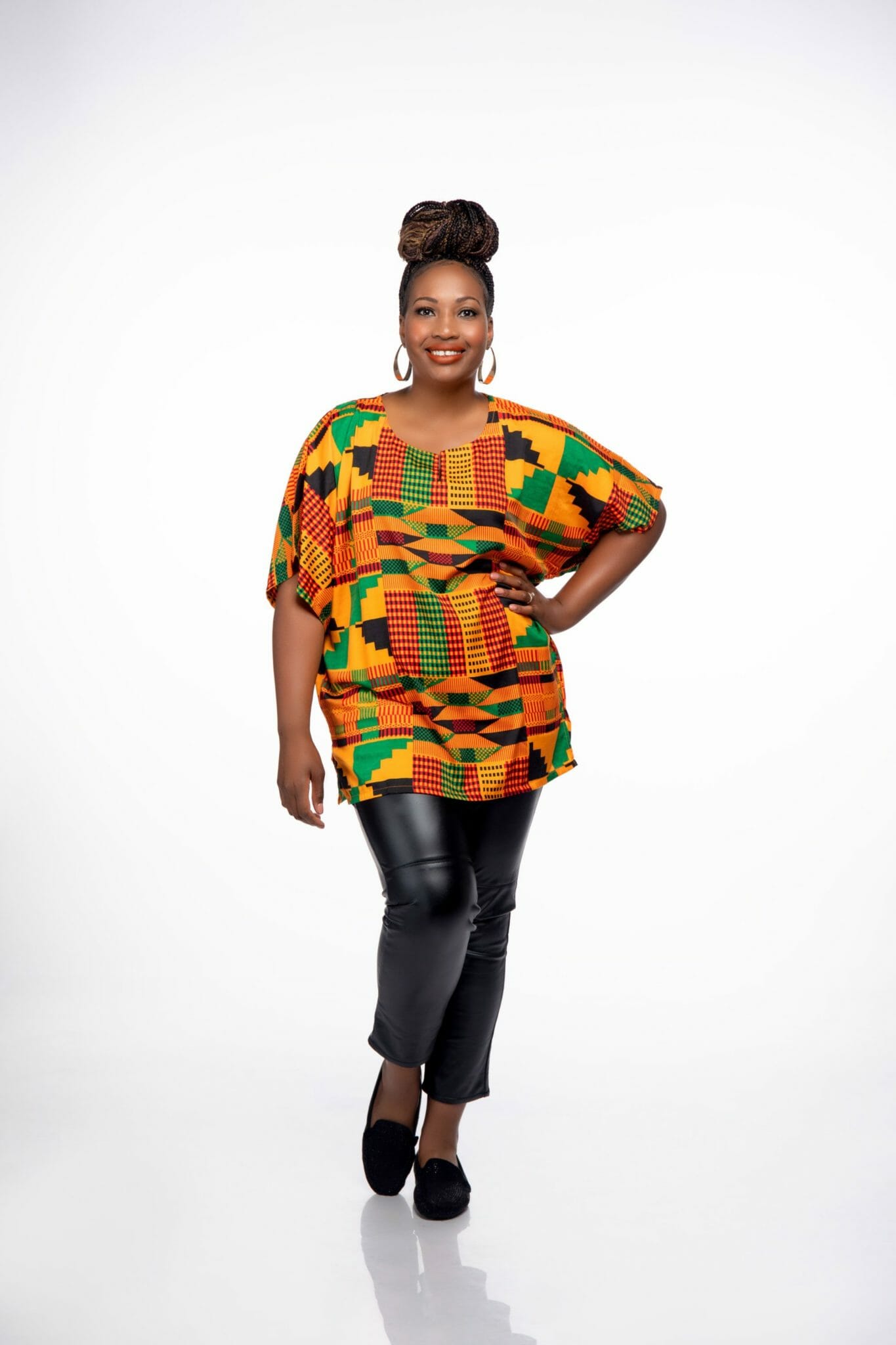 Ashro customer wearing Dashiki Caftan with leather jeans