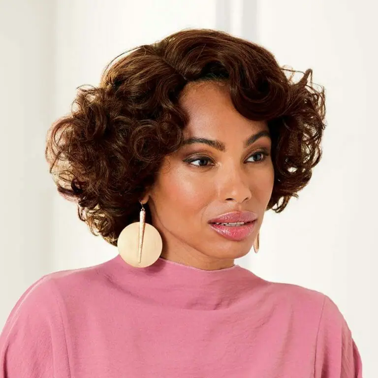 African American woman wearing the Patricia Wig in Dark Auburn.