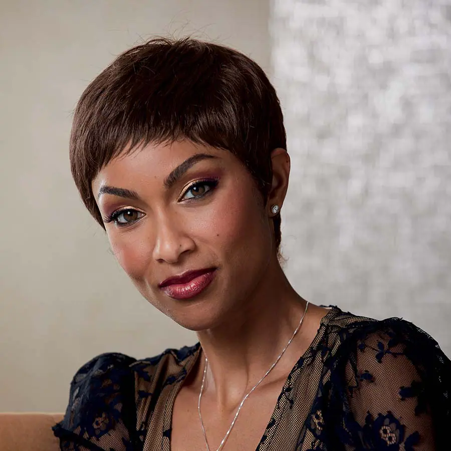 African American woman wearing the Yvette Wig in Medium Dark Brown