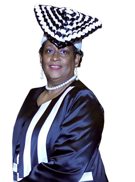 Woman in a blue and white hat with a blue and white dress