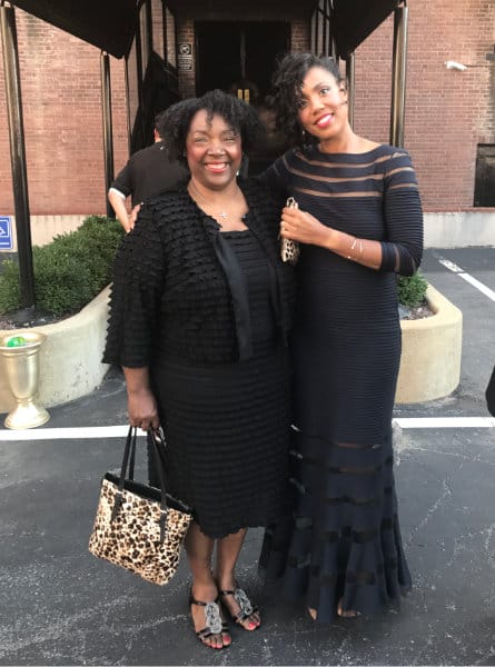 two women in black dresses