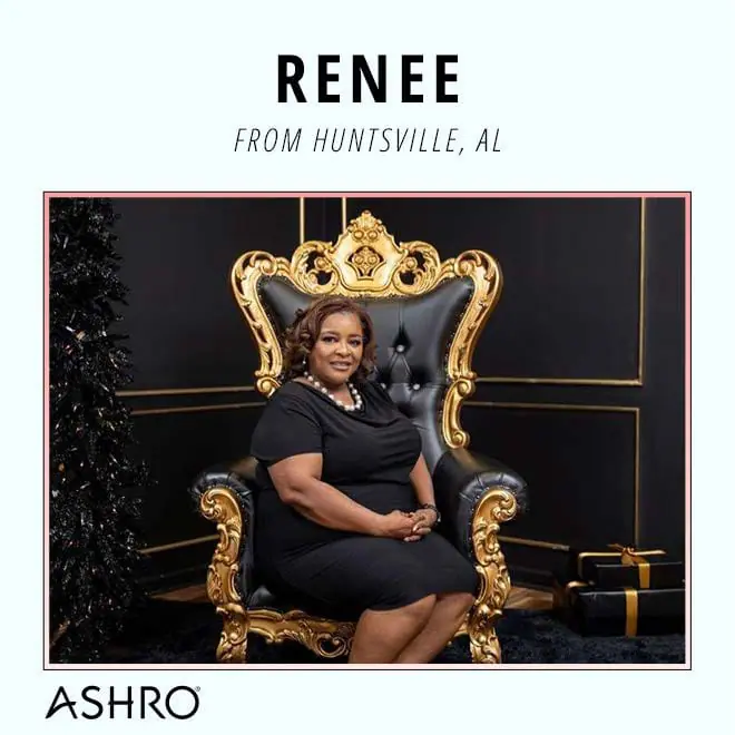 woman in a black dress sitting in a black chair with gold trim