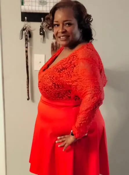 woman posing in a red dress