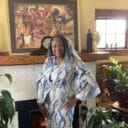 Woman in 2 piece blue and white strip set