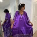 Woman in purple caftan posing