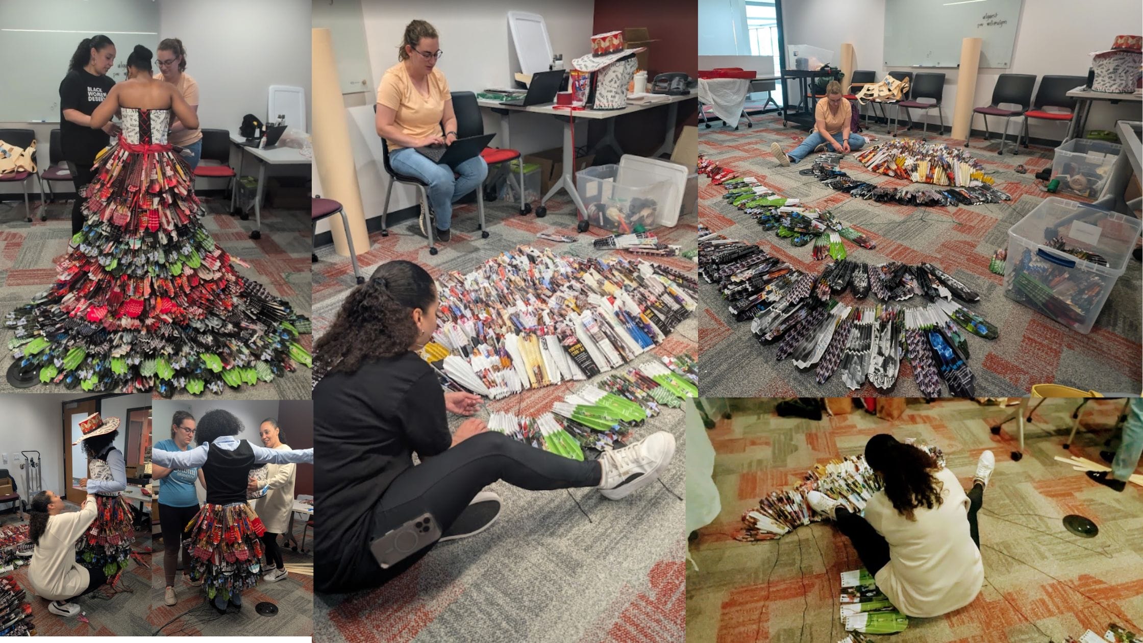 A colorful dress made of various materials is being fitted on a model, while others organize materials on the floor.