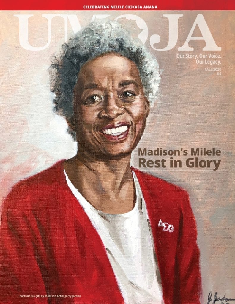 Portrait of a smiling older woman with short gray hair, wearing a red jacket, celebrating her legacy.