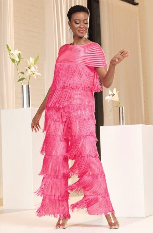 black model in a vibrant pink fringey outfit