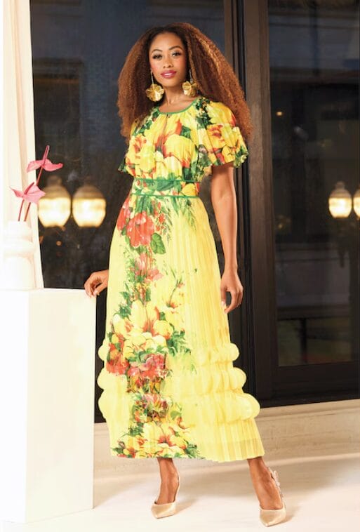 Black woman in yellow floral dress