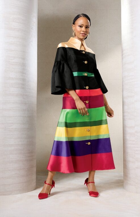 Model wearing the Multi-Striped Fit-and-Flare Dress, showcasing the rich multicolor stripes and decorative gold-tone buttons.