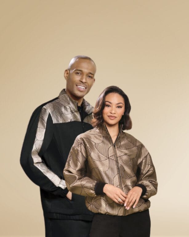Couple wearing matching patterned jackets.