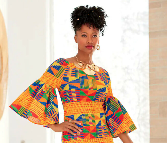 model wearing a kente print dress