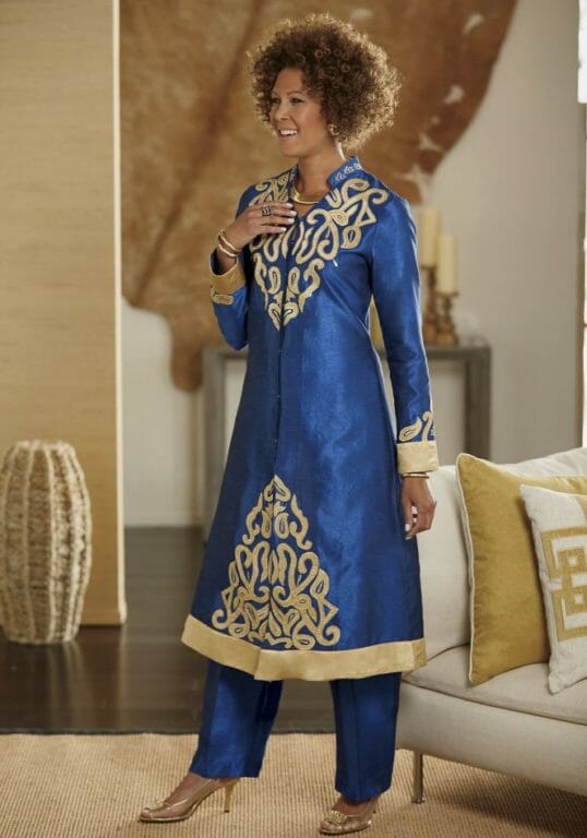 Black woman in Afrocentric Blue and gold long jacket dress pantsuit