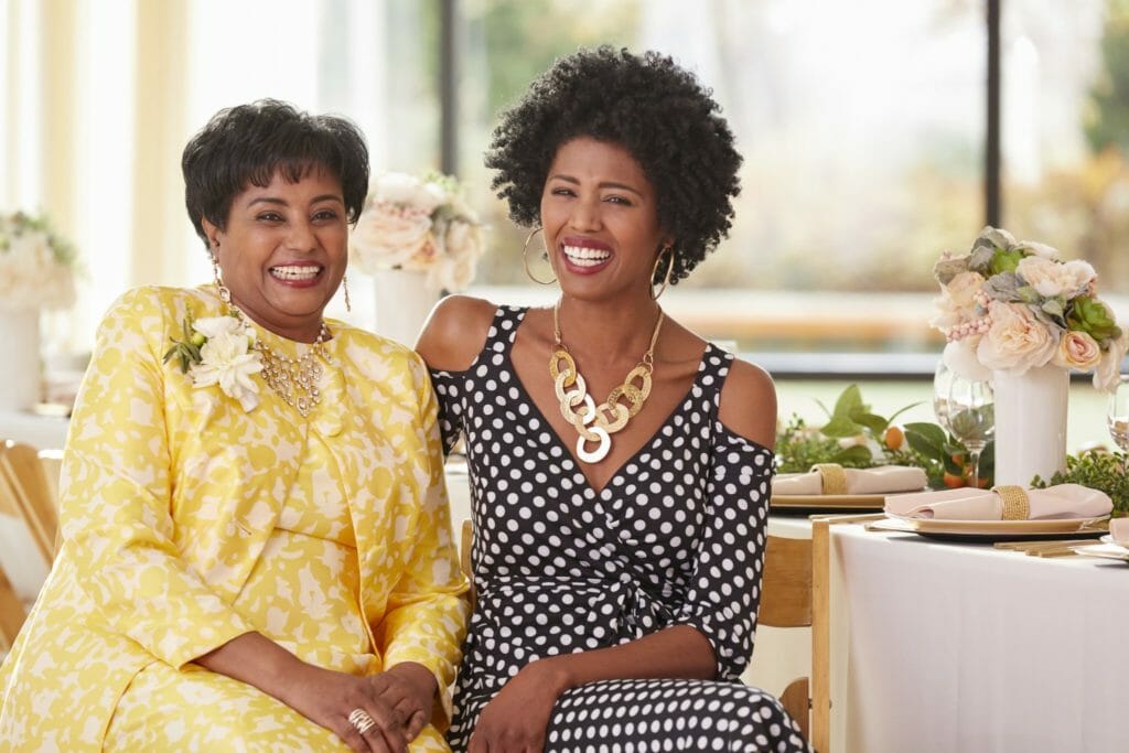 African-American mother and daughter with laughing smiles