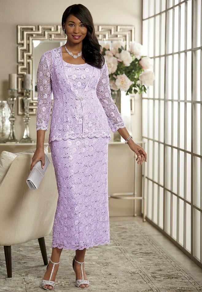 black woman wearing lavendar lace jacket dress