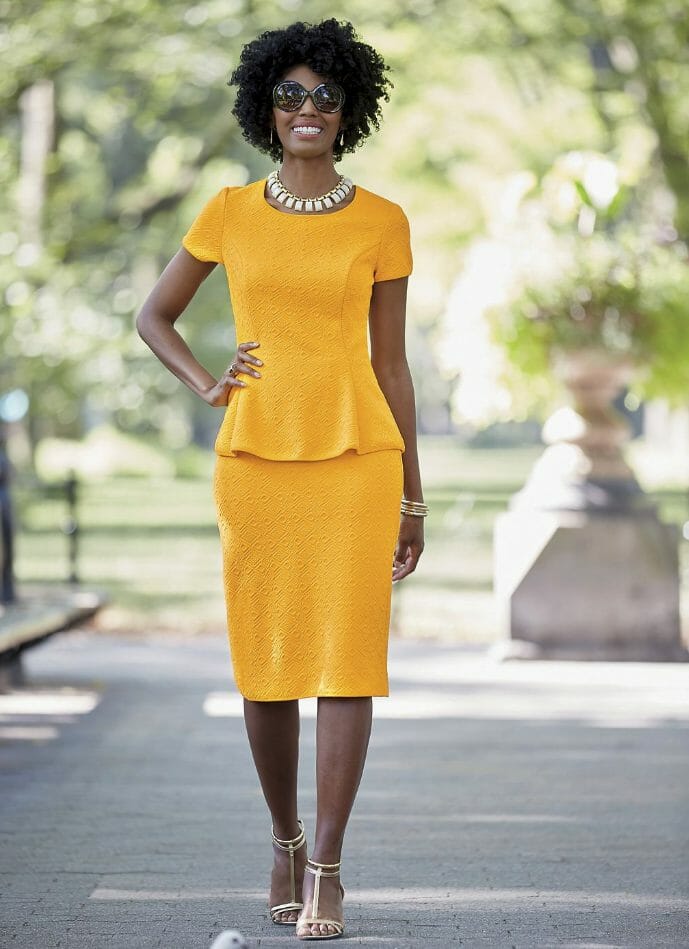 African-American woman in yellow skirt suit