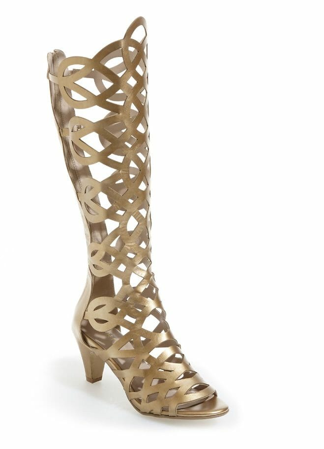 A tall gold, gladiator style heeled sandal.