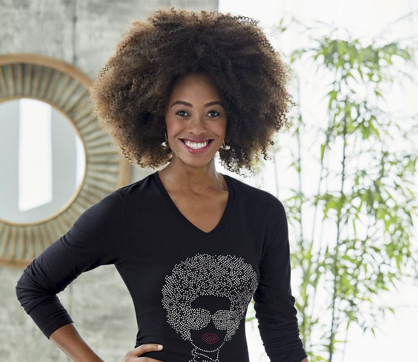 black woman with big frizzy hair in black long sleeve t-shirt with bling lady head