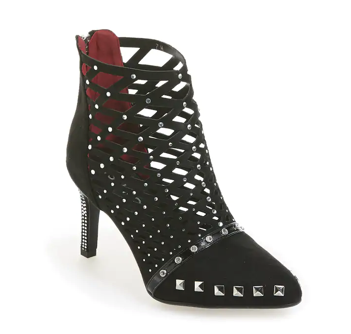A black gladiator style heeled shoe in an open weave, with silver studs.