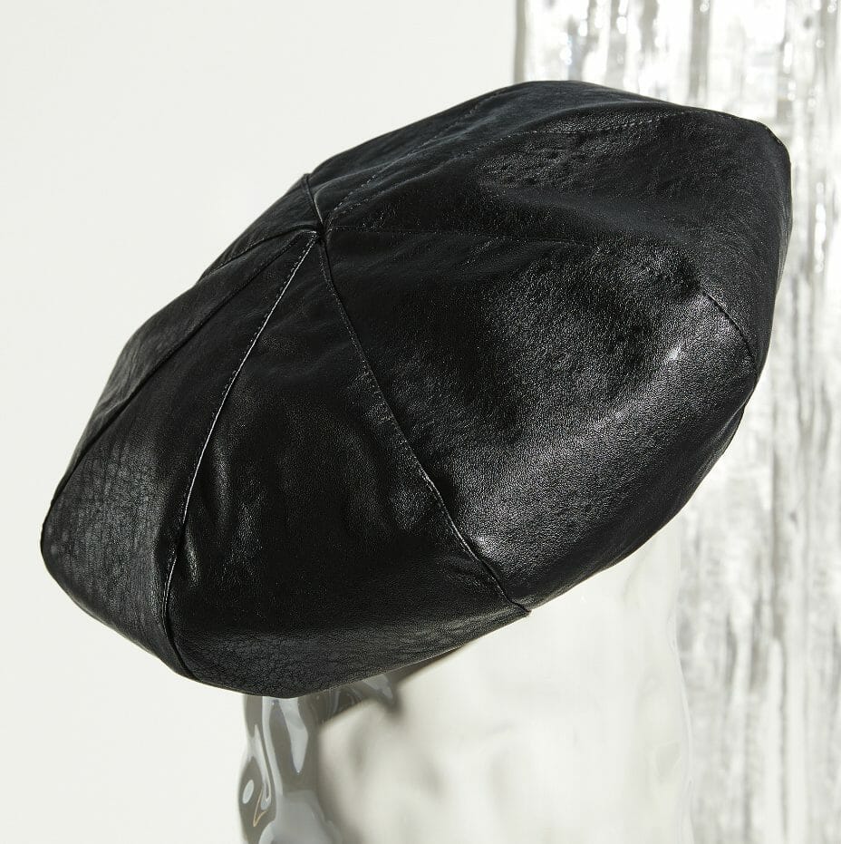 A black faux-leather beret.