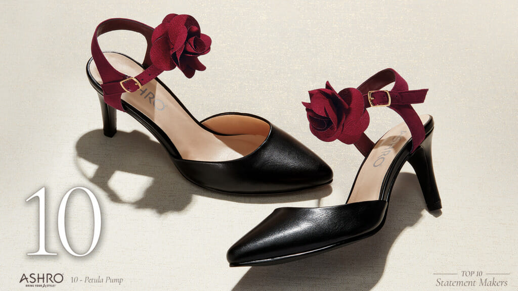 Black open-sided pumps with a dark red rose on the red ankle straps.