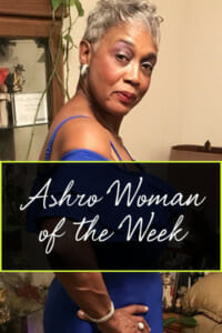 Ashro Woman of the Week, Brenda, a black woman with short silver hair in an off-the-shoulder blue dress.