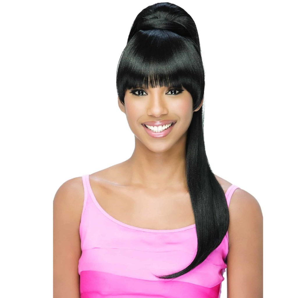 A smiling African-American woman wearing a pink top and a smooth Vivica Fox wig with bangs and a long ponytail.