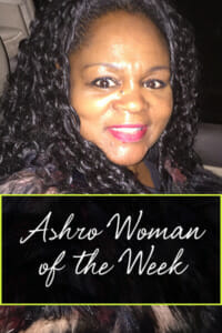 Ashro Woman of the Week, Latasha, a smiling black woman with long curly hair, wearing a black print top.