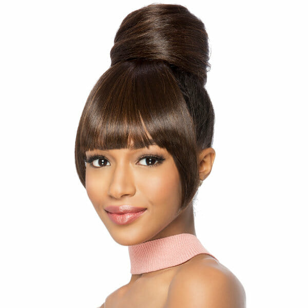 An African-American woman wearing a short, off-black straight Vivica Fox wig with a bun and bangs and pink scarf.