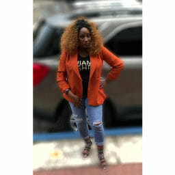 Ashro customer wearing a jacket and jeans