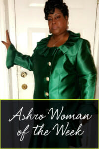Ashro Woman of the Week Robin, an African-American woman wearing a green dress.