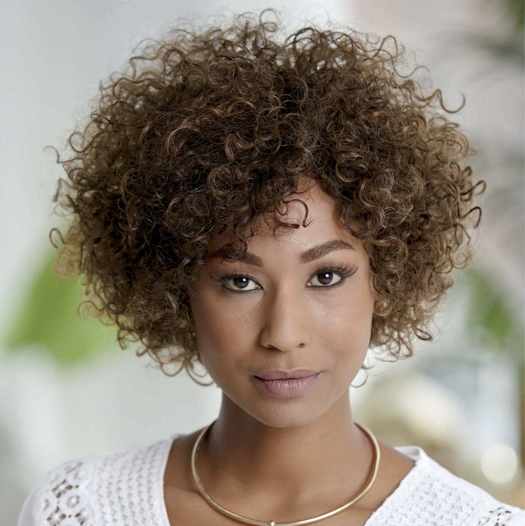 black woman wearing curly wig