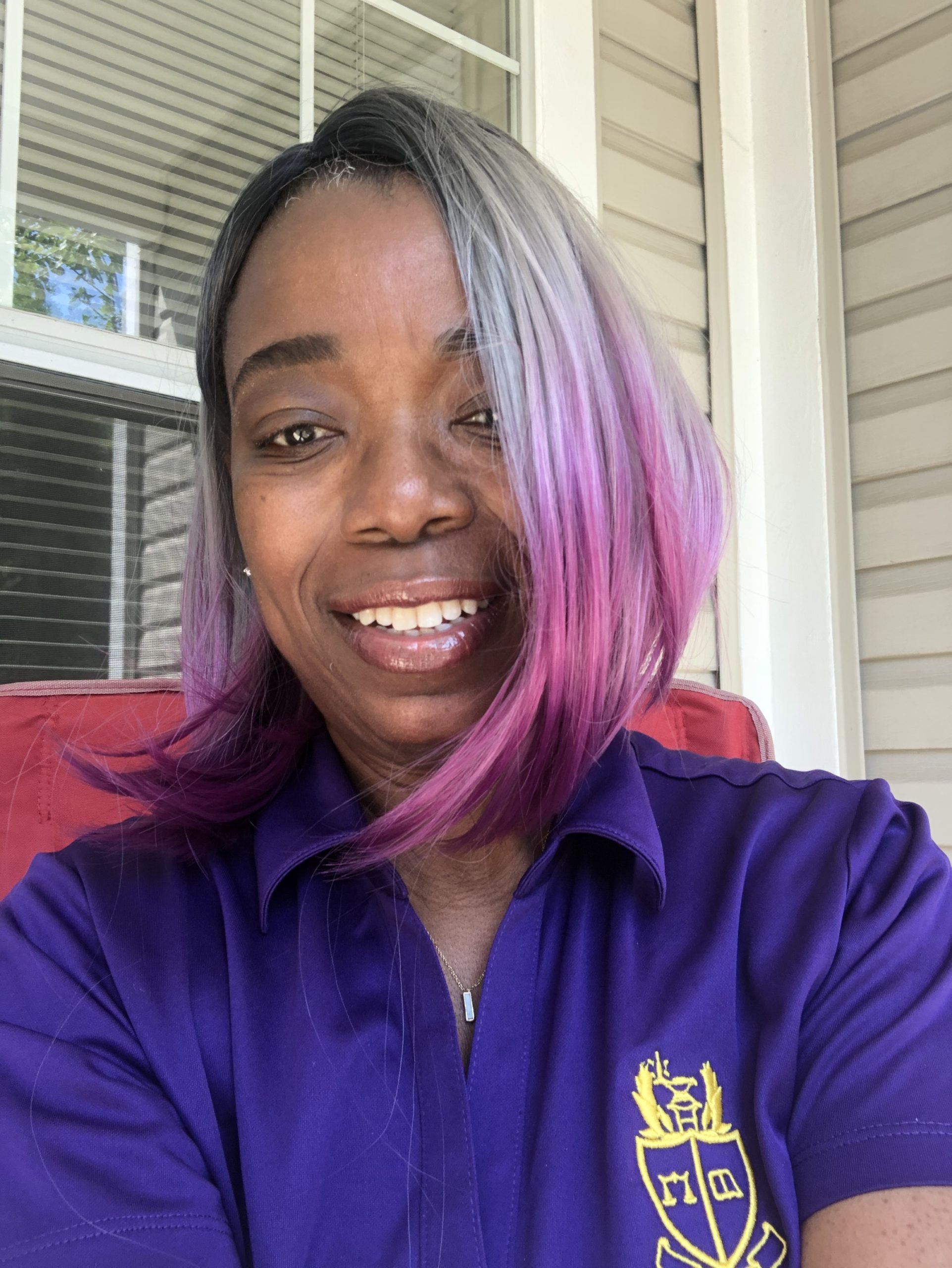 Image of Monique K. in purple wig