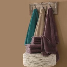 Color Connection 6-Piece Towel Set on hooks with knit ottoman