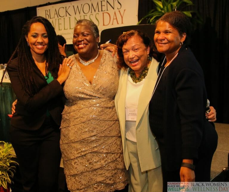 4 Black women at an event Cassandra, 2nd from left
