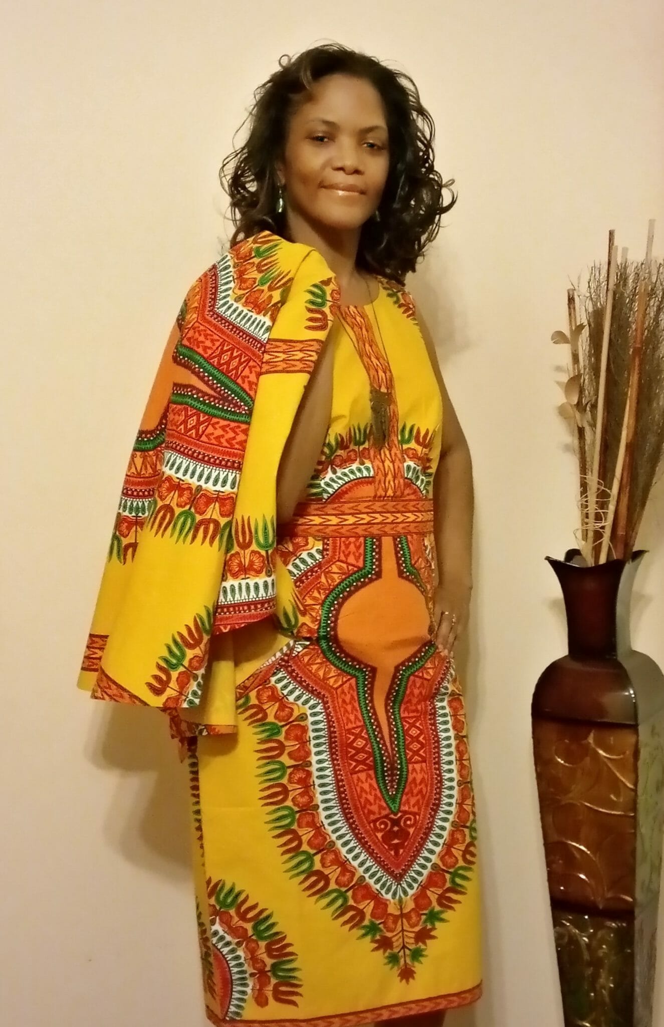 Kimberly (Ashro customer) wearing vibrant afrocentric Sabra Cape Dress.