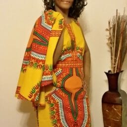 Kimberly (Ashro customer) wearing vibrant afrocentric Sabra Cape Dress.